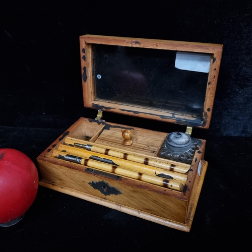 329 - A vintage writing box with glass top, inlay boarder, inkwell, dip pens and nibs.