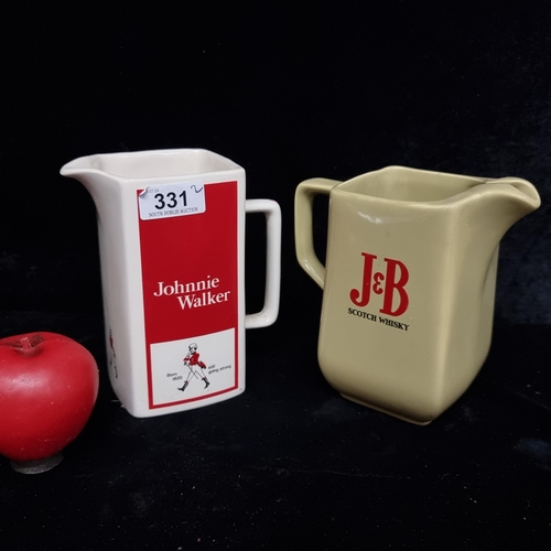 331 - A pair of Wade ceramic scotch whisky jugs. Both in good condition retaining makers mark to base.