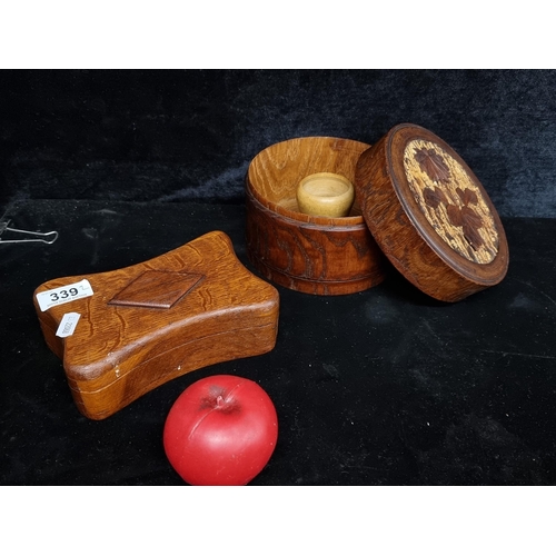 339 - A well made hand turned wooden canister with carved foliate detailing to top and a small storage box... 