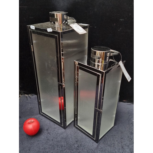 353 - Two brand new 'The Grange' reeded glass hurricane lamps in chrome.