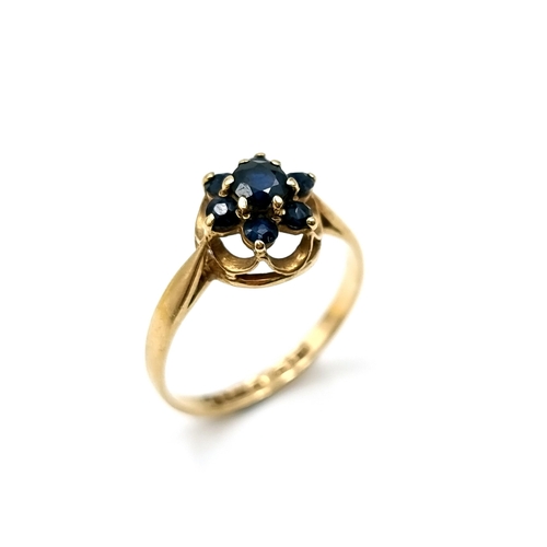 A beautiful sapphire daisy cluster ring set in nine carat gold stamped 375. Ring size M. Weight 1.61 grams.