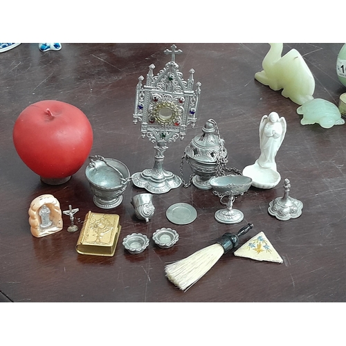 1060 - A small box containing a selection of miniature ecclesiastical themed items