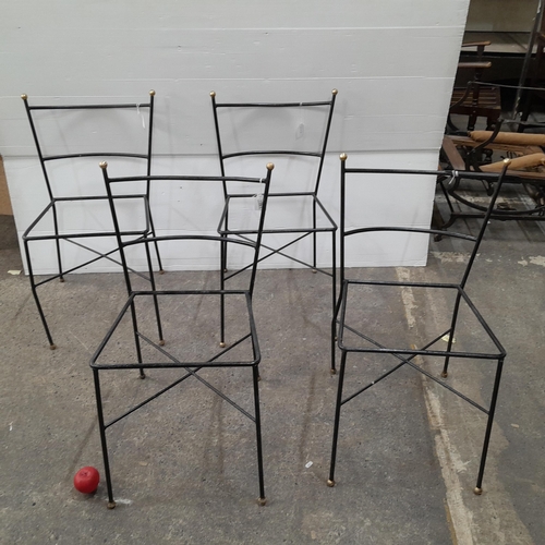 1161 - Four black cast metal chair frames with brass spherical detailing to top and bottom of chair frames