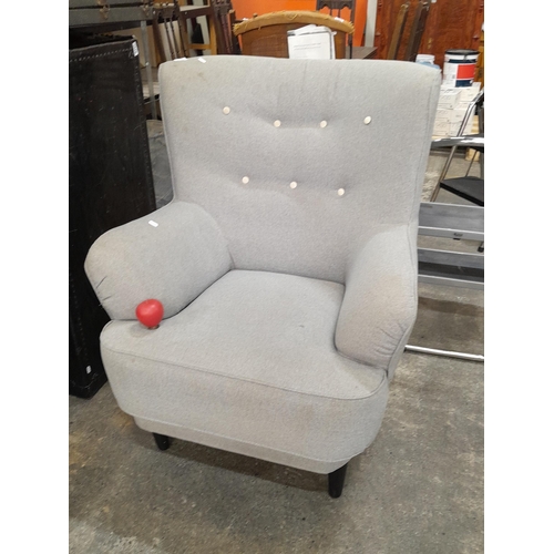 1176 - A gorgeous tall curved back armchair, upholstered in a charcoal grey finish with button back detaili... 