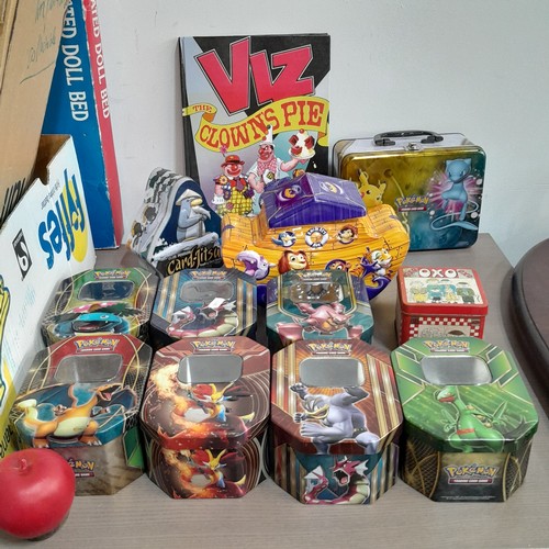 1062 - Three boxes containing a variety of vintage storage tins including some Pokemon trading card game ti... 