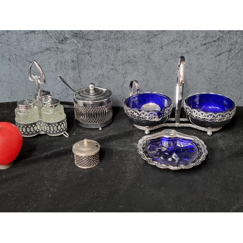 A selection of vintage silver plated tableware including Salt and Pepper shakers and Oyster shell shaped dish.