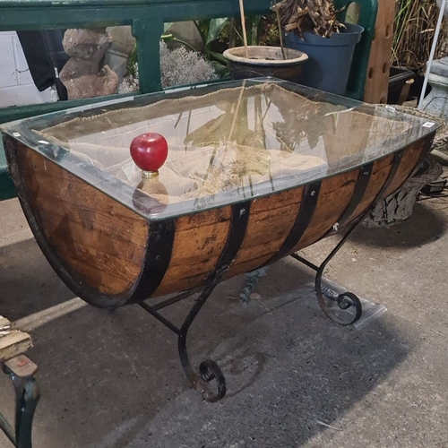 699 - Star Lot : Upcycled half whiskey barrel glass-topped coffee table with iron supports. Rustic appeal.... 