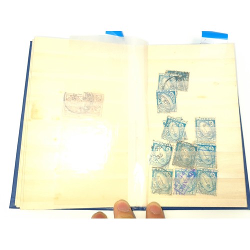 1185 - Two small stock albums both with Irish definitives first and second issue used. E Watermark with app... 