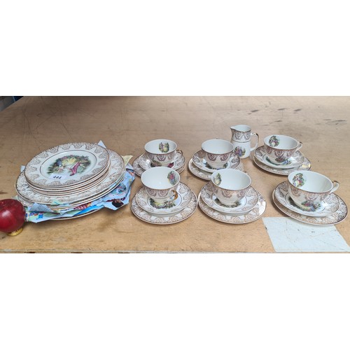 444 - A 32 piece English translucent China set. Includes cups, saucers, side plates and milk jug.