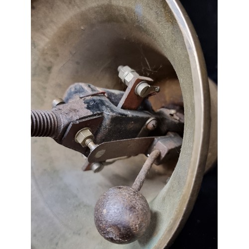 341 - A very heavy antique large brass call bell with unusual mechanism..