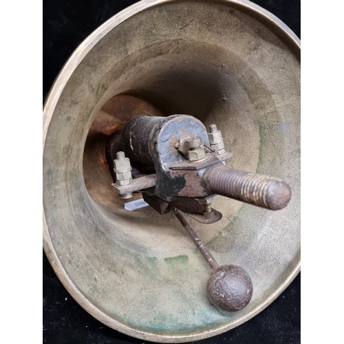 341 - A very heavy antique large brass call bell with unusual mechanism..