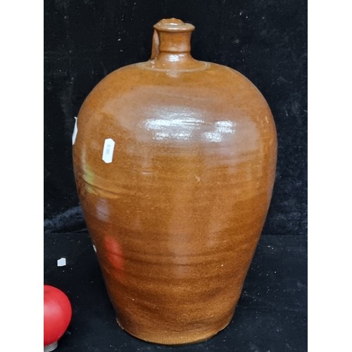 250 - A large stoneware flagon marked 