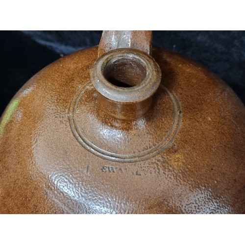 250 - A large stoneware flagon marked 