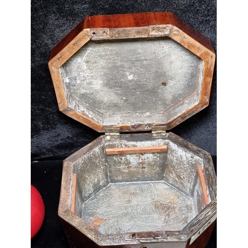 175 - An antique handmade octagonal wooden box with a hinged lid and inlay design to top.