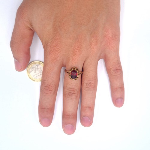 2 - Star Lot : An antique facet cut garnet stone ring set in nine carat gold. Ring size N. Weight 2.79 g... 