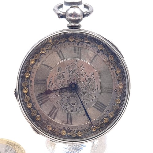 16 - A very pretty antique Sterling Silver with 18ct gold detail fob watch with foliate designed face set... 