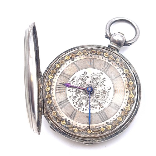 16 - A very pretty antique Sterling Silver with 18ct gold detail fob watch with foliate designed face set... 