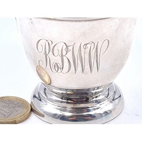 24 - A sterling silver presentation cup set with handle. Hallmarked Birmingham with ribbed body, initiale... 