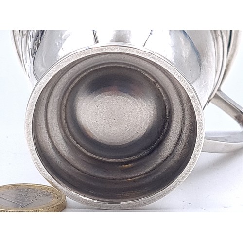 24 - A sterling silver presentation cup set with handle. Hallmarked Birmingham with ribbed body, initiale... 