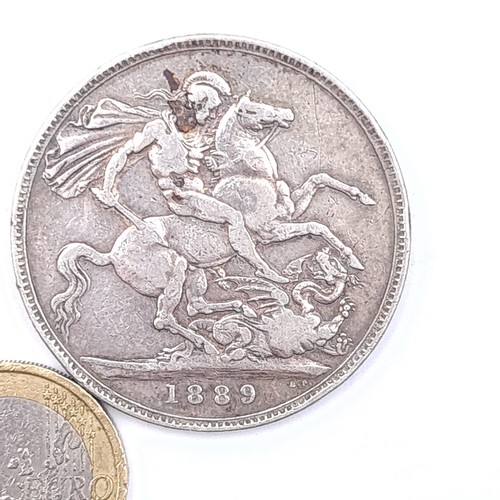 45 - A Queen Victoria 1889 silver crown in fine condition. Weight 27.92 grams.