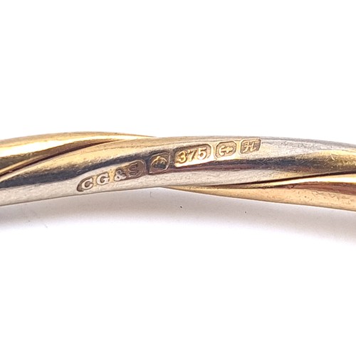 54 - Star Lot : A nine carat gold 375 bracelet bangle. Internal dimensions 6.5cm. Weight 13.42 grams. The... 