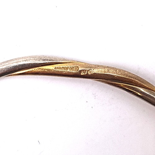 54 - Star Lot : A nine carat gold 375 bracelet bangle. Internal dimensions 6.5cm. Weight 13.42 grams. The... 