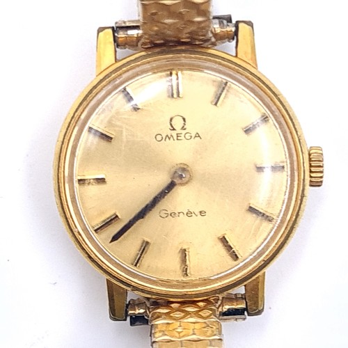 55 - Star Lot : An Omega ladies wrist watch with baton dial and expandable bracelet. In working condition... 