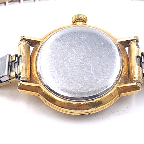 55 - Star Lot : An Omega ladies wrist watch with baton dial and expandable bracelet. In working condition... 