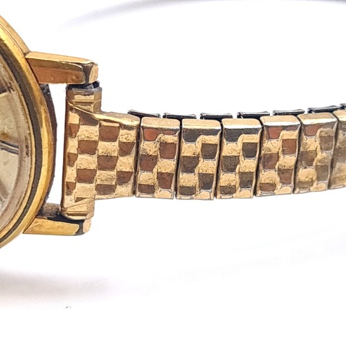 55 - Star Lot : An Omega ladies wrist watch with baton dial and expandable bracelet. In working condition... 