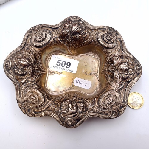 509 - Star Lot : A fine floral repoussé scallop edged tray marked sterling to base. Dimensions 17.14cm. We... 