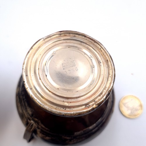 510 - Two items - a sugar bowl and milk jug marked sterling with filled bases. Dimensions for bowl 8cm dia... 