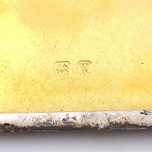 512 - A heavy gauge sterling silver gilt cigarette case with engine turned detailing. Dimension - 13.8 1/2... 