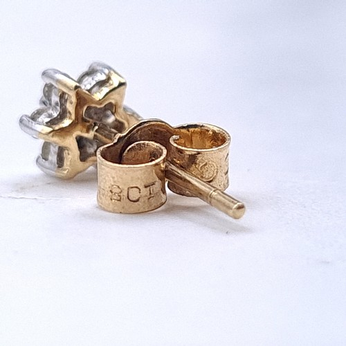 526 - A pair of nine carat gold diamond set stud earrings. Weight .96 grams.