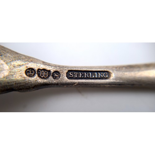 534 - A sterling silver spoon. Hallmarked Sheffield with attractive leaf designed finial. Features an insc... 