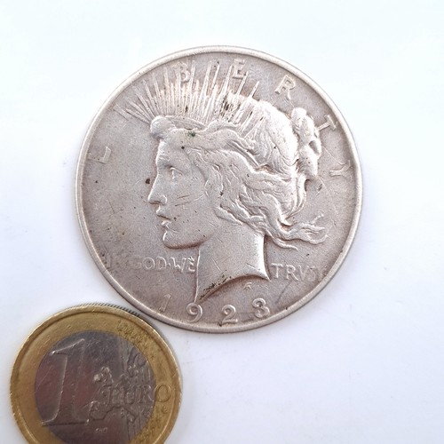 541 - A statue of Liberty one dollar coin dated 1923. .90 silver proof coin.  Weight 26.67 grams.