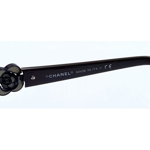 552 - A pair of designer Chanel sunglasses marked made in Italy with serial numbers to frame. Glasses and ... 