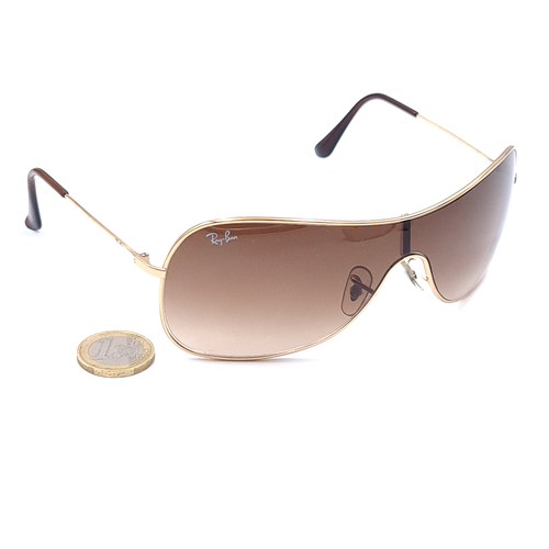 567 - A pair of as new Ray Ban wrap round Italian sunglasses with serial number marks to frames. Comes wit... 