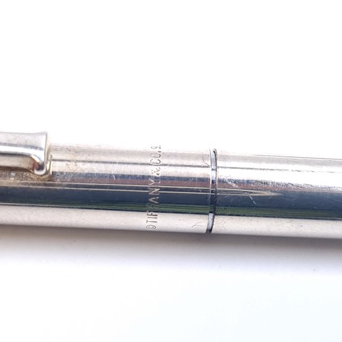 589 - A sterling silver Tiffany ball point pen with Tiffany marked to barrel. Weight of pen 25.35 grams.