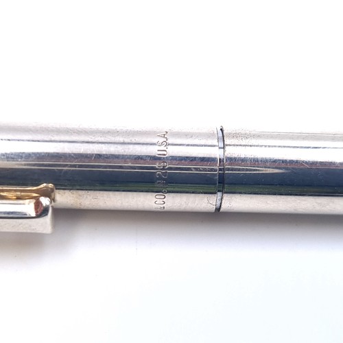 589 - A sterling silver Tiffany ball point pen with Tiffany marked to barrel. Weight of pen 25.35 grams.