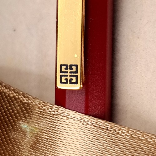 594 - A designer as new original Givenchy ball point pen set with burgundy resin body and gold metal accen... 