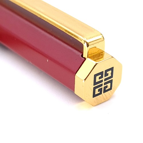 594 - A designer as new original Givenchy ball point pen set with burgundy resin body and gold metal accen... 