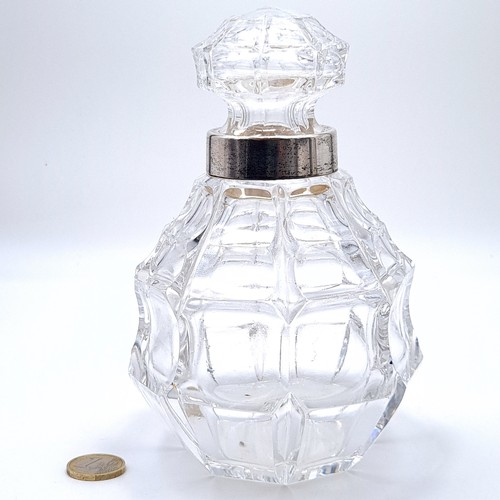 150 - A fabulous cut crystal decanter with original stopper and silver plated neck.