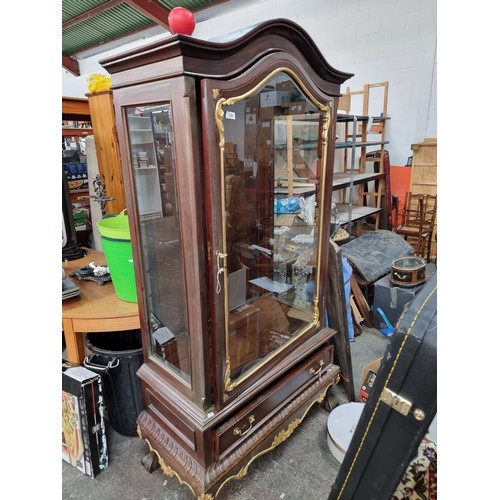 1180 - Star lot : A wonderful continental mahogany and gilt display cabinet. Features arched cornice with a... 