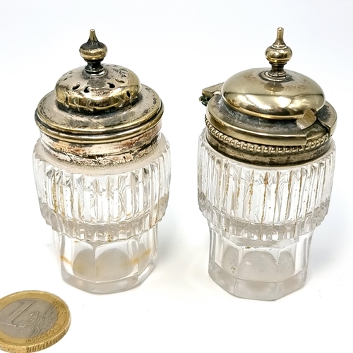 4 - A pair of cut glass finial top cruets with silver plated lids (No marks for silver) Height - 8 cms.