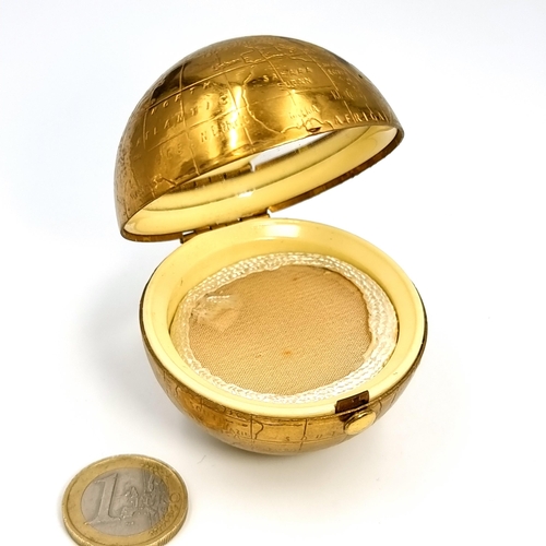 52 - An unusual vintage powder compact in the form of a world globe. Comes with original pouch.