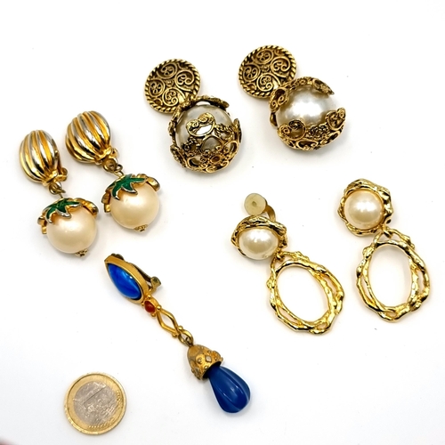 53 - A collection of oversized spherical shaped clasp earrings. Together with an odd pendant clasp earrin... 