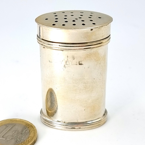 7 - A pretty sterling silver pepper cannister hallmarked Birmingham. Dimensions: Lid - 3 x 2 cms. Height... 