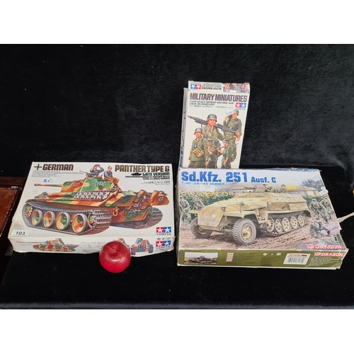 103 - Three military themed vintage games including 'Military Miniatures' by Tamiya, 'Panther type G' mode... 