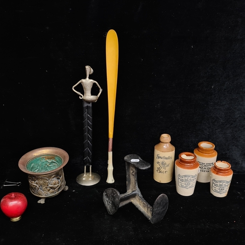 105 - A box containing antique creamware and stoneware bottles, cobbler cast iron shoe repair, brass plant... 