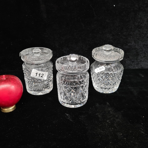 112 - Three lovely Waterford Crystal lidded jars. All in good condition with acid marks to base.